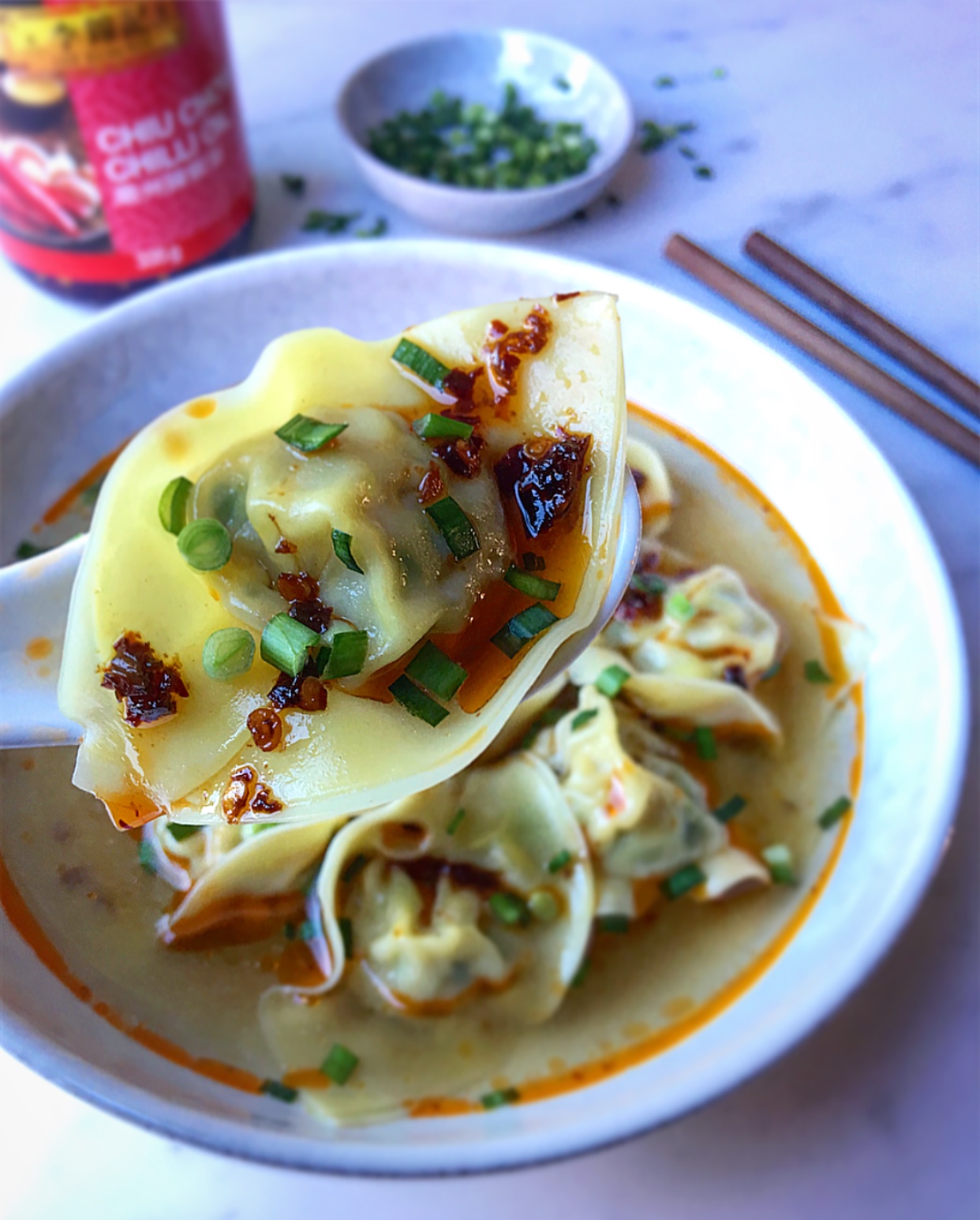 I love to add a generous drizzle of chili oil on my wontons. What about you?