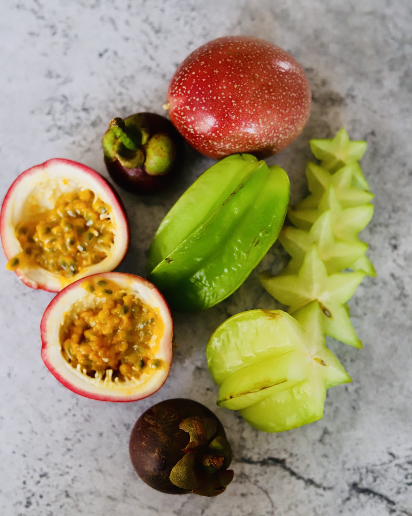 Malaysian exotic fruits: passionfruit, mangosteen and starfruit (carambola).