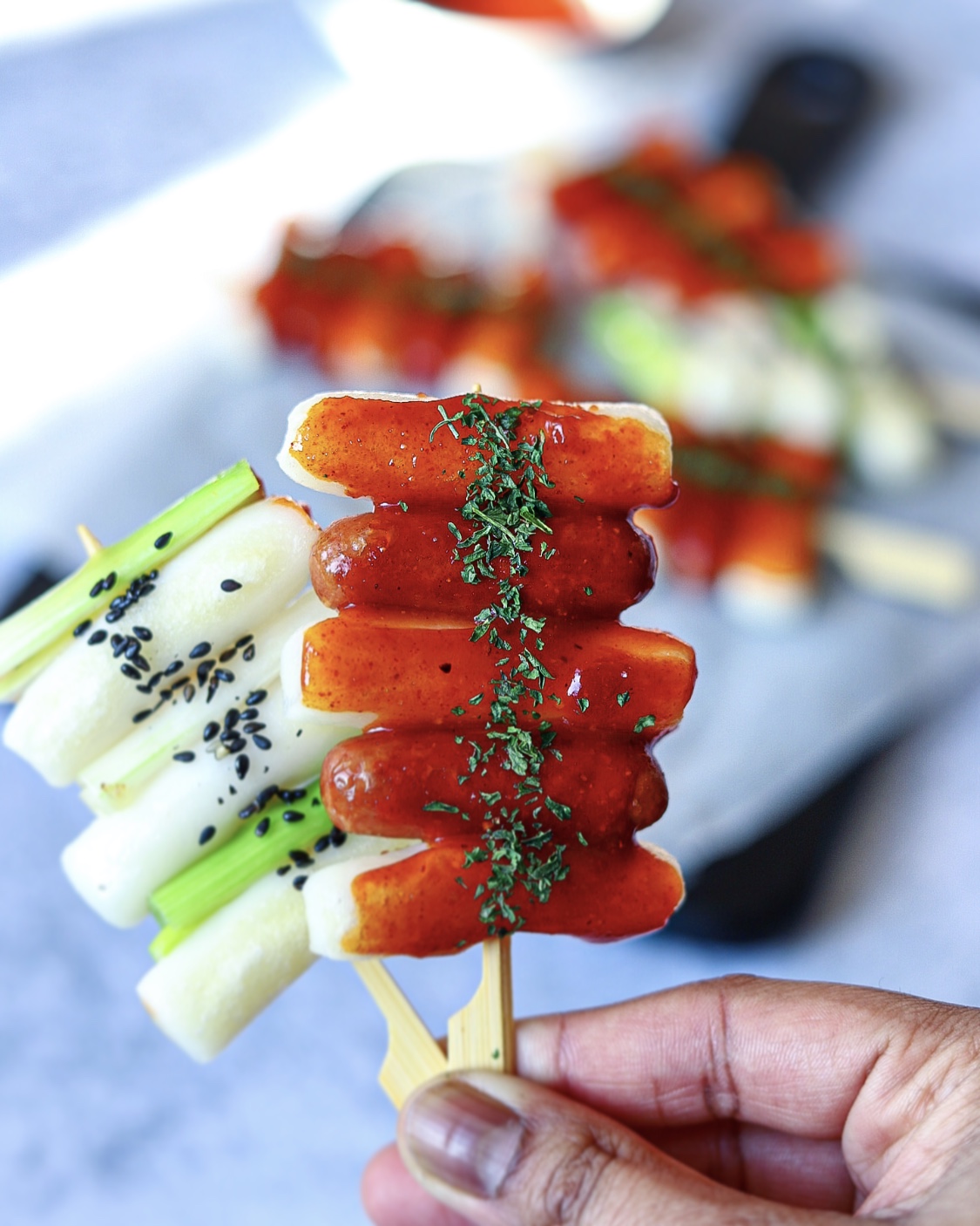 Spicy, chewy, delicious Tteokkochi made with spring onion and sausages.
